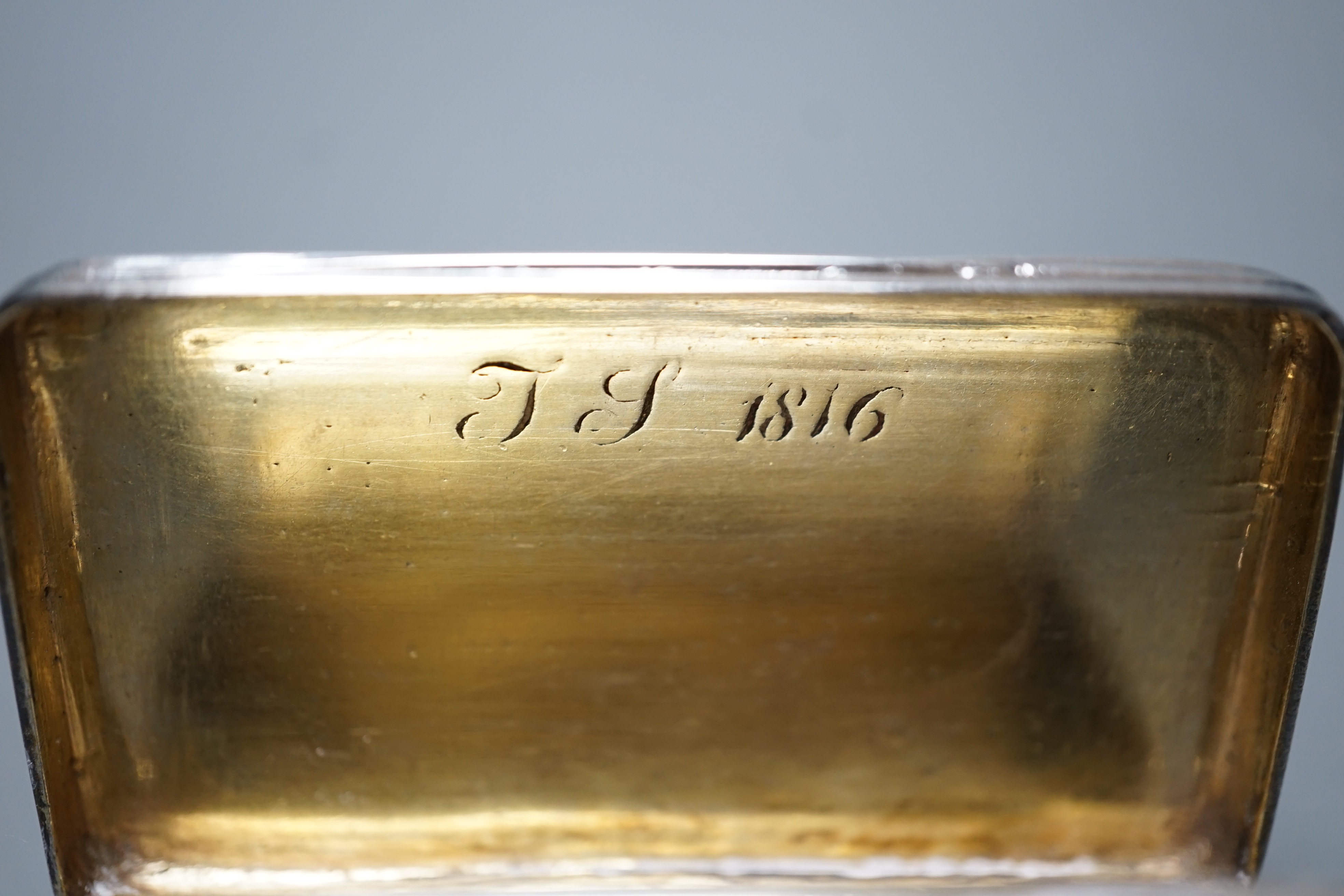 A George III ribbed silver snuff box, Londonm 1799, 72mm and one other similar later ovoid snuff box, TS, Birmingham, 1827.